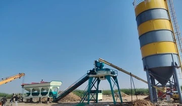 A Nilkanth NE-60-SP stationary concrete batching plant with a pan mixer, successfully installed and operating for construction projects in Vagra, Bharuch, Gujarat.