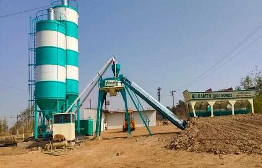 A heavy-duty Nilkanth NE-60-SP concrete batching plant equipped with 60-ton and 100-ton silos, installed to support a large-scale windmill infrastructure project in Maharashtra.